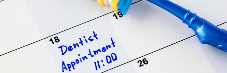 Reminder of a periodontist appointment in calendar with toothbrush