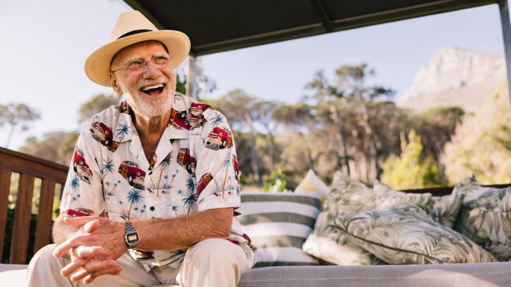 Smiling man after having a denture implant procedure