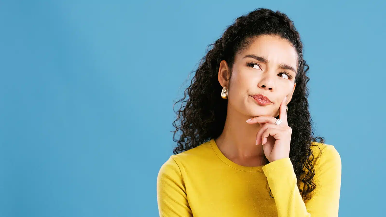 A Woman Wondering When Do You Need to See a Periodontist?
